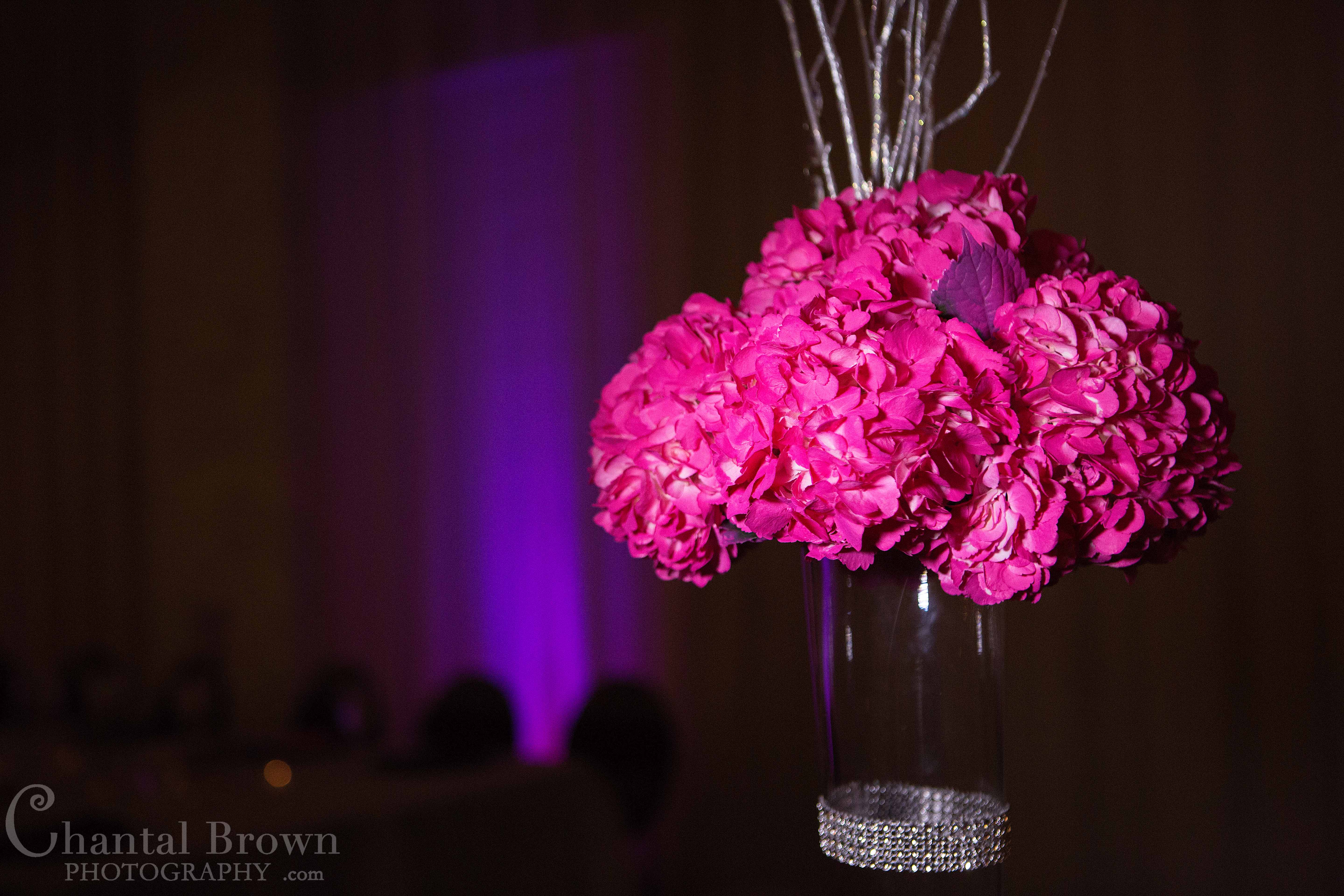 Beautiful pink flowers centerpieces at NYLO hotel Dallas wedding reception photographer